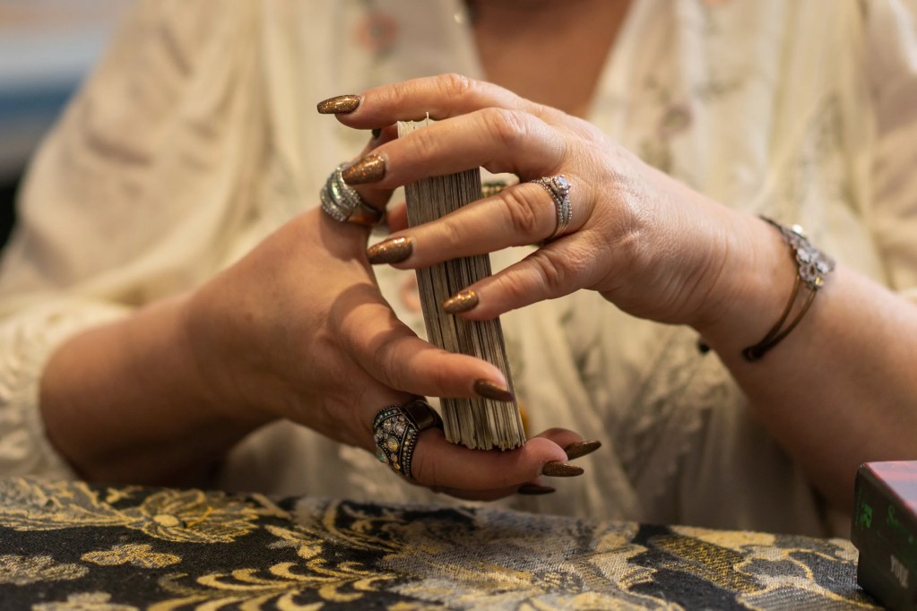 Hands with tarot deck