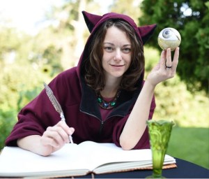 Stephanie G Olson writing at a desk